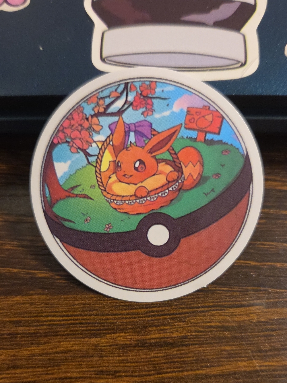 Pokemon Orange Eevee Sticker with Green and Blue Accents